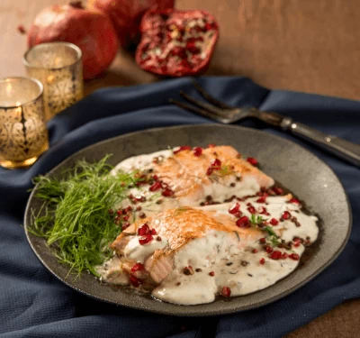 Peixe ao creme com romãs